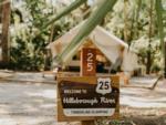 Welcome sign and glamping tent at Timberline Glamping at Hillsborough River - thumbnail