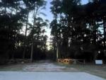 Entrance to park at dusk at Rustic Pine RV Park 55+ - thumbnail