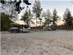 RV with a tent outside at Natchez RV Park - thumbnail