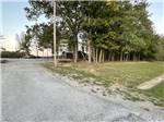 Trees around the building at Natchez RV Park - thumbnail