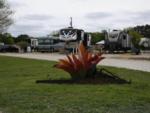 A succulent plant with RVs in the distance at OUR FRIENDS CAMPGROUND - thumbnail