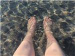 Feet and legs in the water at Lagoon Ranch RV Resort - thumbnail