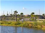 A man fishing in the pond at Galveston Island RV Park - thumbnail