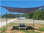 A shaded picnic table at The Escapes RV Park & Storage - thumbnail