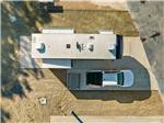 Aerial view of truck and fifth wheel parked at site at Blue Springs RV Park - thumbnail