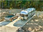 Airstream and classic truck at a site at Blue Springs RV Park - thumbnail