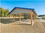 Covered outdoor seating with picnic tables at Blue Springs RV Park - thumbnail