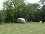 Vintage Airstream in a grassy site at Onion River Campground - thumbnail