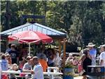 Multi generational people gathering at tables at Mill Creek Marina & Campground - thumbnail