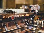 Espresso machine with cups at Ptimaster RV Park - thumbnail