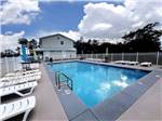 Swimming pool with lounge chairs - thumbnail
