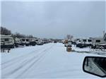 A snow covered road and RV sites at Waterfront Hideaway Ranch - thumbnail