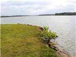 A view of the river from the grassy bank at Waterfront Hideaway Ranch - thumbnail