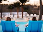People relaxing by the pool - thumbnail