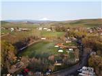 Aerial view of campground with mountain in the background - thumbnail