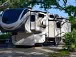 Parked trailer at site River Oaks RV Campground & Retreat - thumbnail