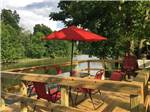 Waterfront table and umbrella - thumbnail