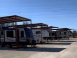 Covered parked trailers at Crossroads RV Park - Big Spring - thumbnail