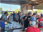 People in line for food in the pavilion - thumbnail