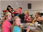Children participating in craft activities - thumbnail