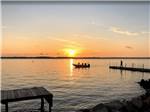 Fishermen in a boat at sunset - thumbnail