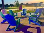 Adirondack chairs under a covered seating area - thumbnail