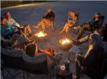People gathering by the fire pit - thumbnail
