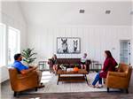 People sitting on sofas in the farmhouse - thumbnail