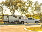 A travel trailer and truck - thumbnail