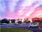 A multi colored sunset over the park - thumbnail
