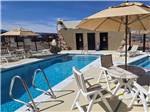 Table and chairs by the pool - thumbnail