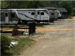 Row of travel trailers at sites - thumbnail