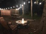 Firepit surrounded by chairs - thumbnail