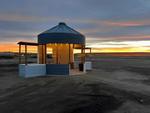A lighted gazebo at sunset at CO Journey RV Park - thumbnail