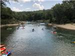 Kayakers heading down the river - thumbnail