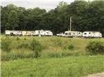 A group of RVs at sites - thumbnail