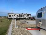 Parked RV and trailer at site Magnolia Beach RV Park - thumbnail