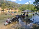 People cooling off in the river - thumbnail