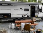 Parked trailer next to panic table at Tsawaak RV Resort and Campground - thumbnail