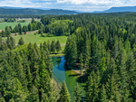 Aerial view of lake and trees at Lake Sena Campground at Circle 8 Ranch - thumbnail