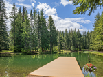 A view of the lake and trees at Lake Sena Campground at Circle 8 Ranch - thumbnail