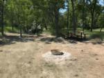 Fire pit near panic table at Scottsbluff YMCA Trails West Camp - thumbnail