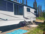 An RV parked in a site - thumbnail