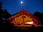 Night time view of tent at site Adirondack Safari - thumbnail
