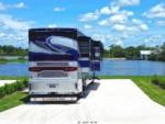 A motorhome in a paved site by the lake - thumbnail