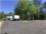 A travel trailer parked in a gravel site - thumbnail