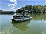 A pontoon boat on the lake - thumbnail