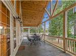 Patio furniture on the deck of a rental cabin - thumbnail