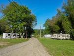 A gravel road leading to RV sites - thumbnail