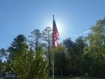A view of an American flag against the sky - thumbnail